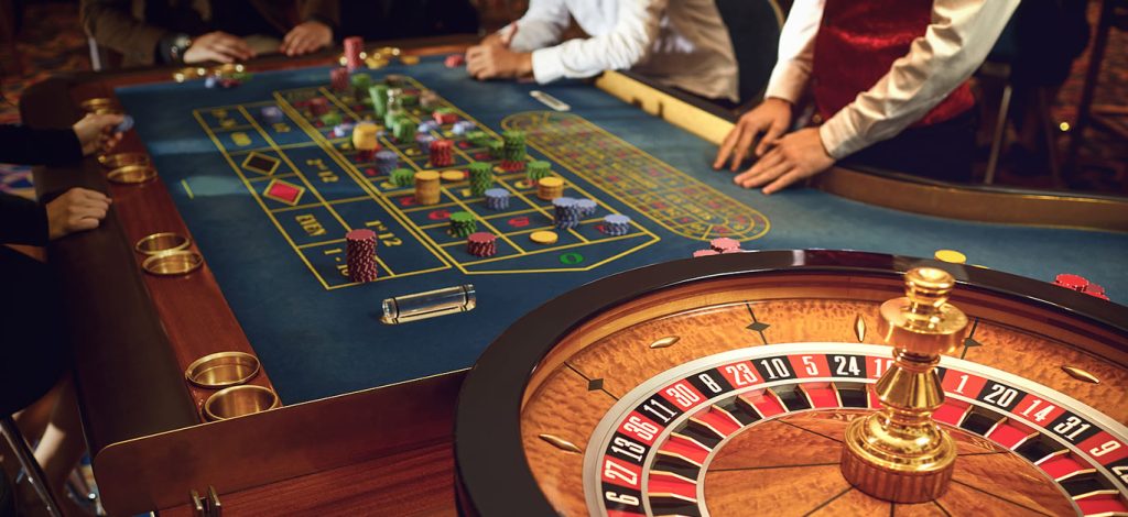 Players enjoying roulette at a casino table